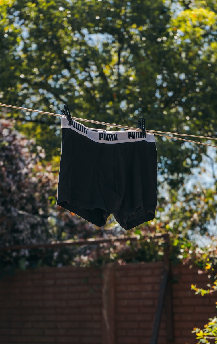 black and white shorts hanging on clothes hanger